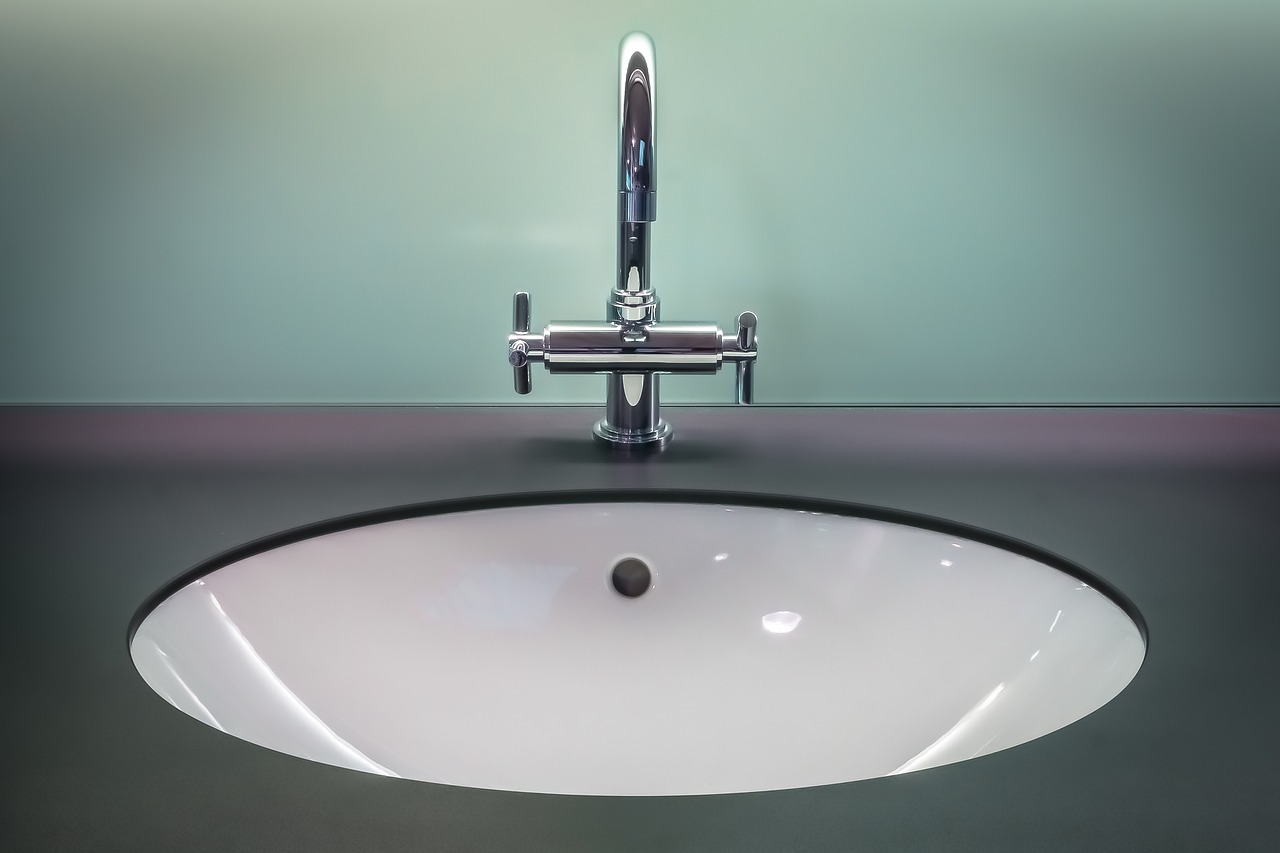 Undermount basin set into a polished stone bathroom vanity top in an Asheville bathroom